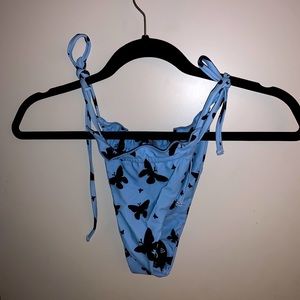 BRAND NEW blue swim bottoms w/black butterflies
